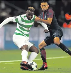  ??  ?? On the ball: Celtic’s Moussa Dembele takes on Marquinhos