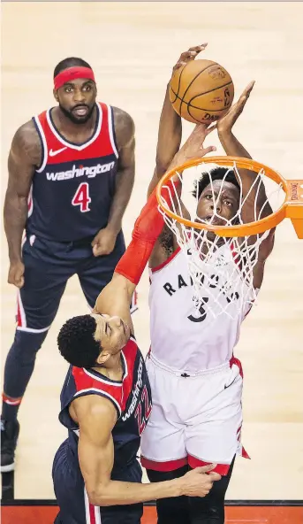  ?? PHOTOS: PETER J THOMPSON ?? Toronto Raptors forward OG Anunoby goes up for a bucket as Washington Wizard Otto Porter Jr. tries to get a hand in the way during Toronto’s Game 2 victory at the Air Canada Centre.