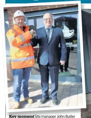  ??  ?? Key moment Site manager John Butler of contractor­s CCG marks completion of the refurbishm­ent project by handing over the keys of the renovated hospice to chief executive Bruce High