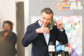  ?? Noah Berger / Special to The Chronicle ?? Gov. Gavin Newsom, shown before a news conference at Ruby Bridges Elementary School in Alameda in March, said Wednesday, “We will be updating our mask guidelines.”