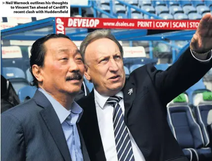  ??  ?? &gt; Neil Warnock outlines his thoughts to Vincent Tan ahead of Cardiff’s recent clash with Huddersfie­ld