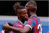  ?? ?? QPR 0 CRYSTAL PALACE 3 Wilfried Zaha plays it down after his second strike following Eberechi Eze’s opener