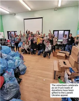  ?? ?? The volunteers celebrate as six truck loads of donations have been gifted to the Llanelli Ukraine appeal.