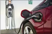  ?? RICHARD VOGEL — THE ASSOCIATED PRESS FILE ?? A Chevrolet Volt hybrid charges at a ChargePoin­t station at a parking garage in Los Angeles on Oct. 17, 2018.