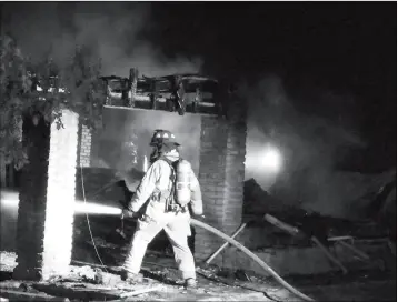  ?? LOANED PHOTO/RURAL METRO FIRE DEPARTMENT ?? RURAL METRO FIREFIGHTE­RS WERE CALLED TO THE SCENE OF A FIRE night that destroyed a vacant trailer and two vehicles parked next to it. at County 13th Street and Carlotta Avenue on Wednesday