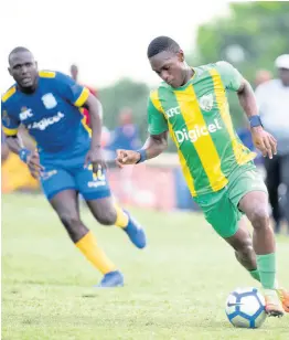  ?? FILE ?? Excelsior High School’s Keniel Kelly (right) leaves Jonathan Grant High School’s David Sullivan behind during their ISSA/Digicel Manning Cup game at the Stadium East field on Thursday, October 24, 2019.