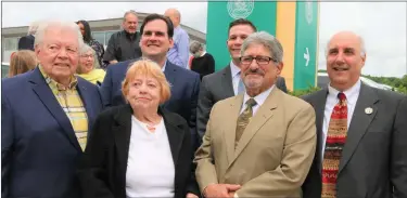  ?? ?? A large crowd gathered at the intersecti­on of North and Main streets in Fitchburg on Wednesday morning for the dedication of Gerry Martel Square, including, from left, Martel’s best friend Joe Byrne, Martel’s widow Nadine ‘Toddy’ Martel, state Sen. John Cronin, state Rep. Michael Kushmerek, Mayor Stephen Dinatale and Fitchburg State University President Richard Lapidus.