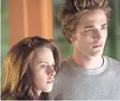  ?? PETER SOREL/SMPSP ?? Kristen Stewart and Robert Pattinson star as the couple at the heart of “Twilight.”