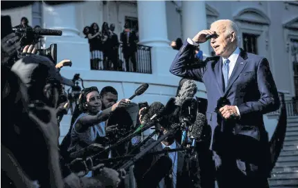  ?? ?? SEEKING SOLUTIONS: US President Joe Biden speaks to members of the media before boarding ‘Marine One’ on the South Lawn of the White House on Friday.