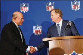  ?? JOHN BAZEMORE / ASSOCIATED PRESS ?? NFL Commission­er Roger Goodell (right) welcomes David Tepper of the Carolina Panthers at a May owners’ meeting in Atlanta.