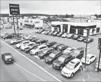  ?? TED SHAFFREY / AP ?? New vehicles are displayed for sale at a Buick GMC dealership in Union, N.J. About 85 percent of new car buyers will use some sort of financing to pay for their vehicle, according to credit reporting company Experian.