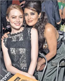  ??  ?? LABEL NEWS: Emma Stone and Salma Hayek Pinault are both decked out in Bottega Veneta, the Italian fashion house shifting to downtown digs on Whitehall Street.