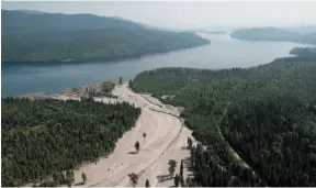  ?? CP FILE PHOTO ?? Contents from a tailings pond pour down Hazeltine Creek into Quesnel Lake near the town of Likely on Aug. 5, 2014.