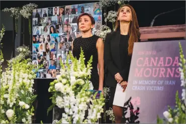  ?? Canadian Press photo ?? Banafsheh Taherian, left, and Kyan Nademi from Tirgan stand on stage during a memorial organized by the Iranian-Canadian charity Tirgan for the victims of the Iranian air crash, in Toronto, Sunday.