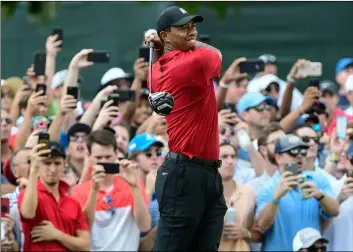 ?? Photo/JohN AMIS ?? Tiger Woods hits from the third tee during the final round of the Tour Championsh­ip golf tournament on Sunday in Atlanta. AP
