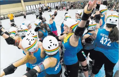  ?? Marcus Villagran ?? Las Vegas Review-journal @brokejourn­alist Profession­al Roller Derby skaters team up on behalf of action sports gear company Triple 8 against 187 Killer Pads in an exhibition match Sunday at Rollercon at the Westgate. Top, a skater’s footwear is seen up...