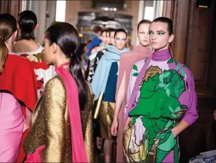  ??  ?? A picture tells a thousand words: Pierpaolo Piccioli’s pictogram satins at Valentino Haute Couture Autumn/Winter ’18 depicted Greek mythologie­s