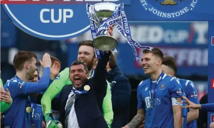  ??  ?? The St Johnstone manager, Callum Davidson, hoists the trophy aloft after their Scottish League Cup triumph. Photograph: Andrew Milligan/Reuters