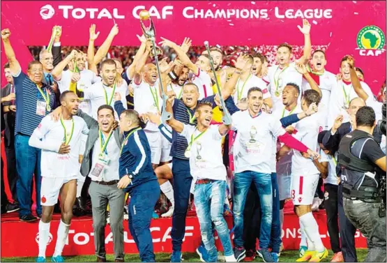  ??  ?? Wydad Casablanca’s players celebrate after winning the CAF Champions League final football match between Egypt’s Al-Ahly and Morocco’s Wydad Casablanca on Nov 4, at Mohamed V.
Stadium in Casablanca. (AFP)