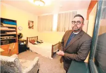  ??  ?? The Rev. Jeff Johnson of the Universal Lutheran Chapel in Berkeley stands in a sanctuary apartment in the basement of the church. The church built the small apartment to host a person or a small family.