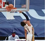  ??  ?? Pelicans guard Josh Hart (3) scores in the second half against the Jazz in New Orleans on Monday.