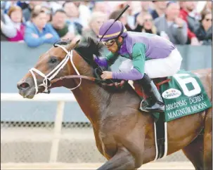  ?? Submitted photo ?? TO THE MOON: Jockey Luis Saez rides unbeaten Magnum Moon to win the Grade 1 $1 million Arkansas Derby Saturday at Oaklawn Park and the lead in qualifying points for the Kentucky Derby, which will be run at Churchill Downs in Kentucky on May 5. Photo by...