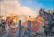  ?? AP ?? Rescuers work at a damaged building after a Russian missile attack in Kyiv region, Ukraine, on Wednesday.