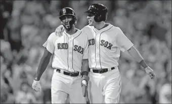  ?? CHARLES KRUPA/AP PHOTO ?? Eduardo Nunez, left, and Ian Kinsler smile as they head back to the dugout after scoring on a double by Blake Swihart during an 11-run seventh inning that rallied the Red Sox to a 14-6 win over the Miami Marlins on Wednesday night at Fenway Park.