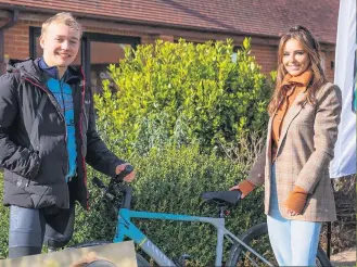  ??  ?? SMILES TO GO Cheryl meets Billy Monger en route as he prepares to get back on his bike