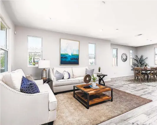  ?? COURTESY PHOTO ?? Townhomes at Prato feature open floor plans of up to 1,758 square feet, including great rooms with balconies, three bedrooms and 3.5 bathrooms.