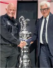 ??  ?? The closest Luna Rossa boss Patrizio Bertelli (right), who is CEO of the Prada group, came to getting his hands on the America’s Cup this year was shaking his with Team NZ chief Grant Dalton beside the Cup.