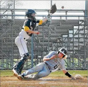  ?? GENE WALSH — DIGITAL FIRST MEDIA ?? Abington’s Sonny Stevenson slides in for a run as CB West’s Josh Crecca reaches for the ball.