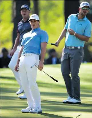  ?? HARRY HOW/ GETTY IMAGES ?? Rory McIlroy reacts to a putt on the sixth green Tuesday in a Masters practice round.