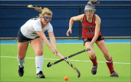  ?? GENE WALSH — DIGITAL FIRST MEDIA ?? Germantown Academy’s Colleen Carrigan battles Academy of Notre Dame’s Bell McHugh for possession of the ball during the PAISAA championsh­ip at The Proving Grounds Wednesday.