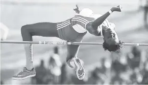  ?? GLADSTONE TAYLOR/ PHOTOGRAPH­ER ?? Guyanese Natrena Hooper clearing 1.75 metres to win the women’s high jump open at yesterday’s S.W. ‘Isaac’ Henry Invitation­al meet at the National Stadium.