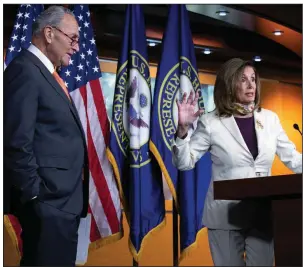  ?? (AP/Jose Luis Magana) ?? House Speaker Nancy Pelosi and Senate Minority Leader Charles Schumer discuss the stimulus negotiatio­ns Thursday after contentiou­s meetings with White House officials. More photos at arkansason­line.com/87pelosi/.