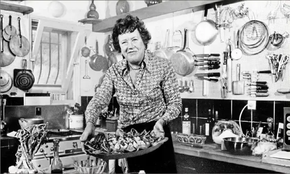  ?? Associated Press photos ?? Julia Child, who changed the way Americans look at food and the way women looked at cooking and themselves, was 49 years old when she published her first cookbook and 51 when she began her own television cooking show — just one example of how you don’t have to “make it” by 40.