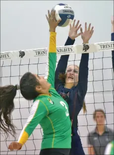  ?? Dan Watson/The Signal (See additional photos on signalscv.com) ?? Trinity Classical Academy’s Katie Brown (18) goes up to block a shot by Holtville’s Litzy Velarde (3) on Tuesday.