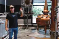  ??  ?? Co-founder and CEO Tim Piersant talks about the distilling process at Chattanoog­a Whiskey Co.