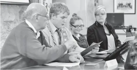  ?? [LIZ BEVAN / THE OBSERVER] ?? Wellesley Youth Advisory Council member Dalton Koch was the mayor for an evening on Monday, with Wellesley Township Mayor Joe Nowak guiding him through the evening’s agenda. The mock youth council meeting gave the kids a chance to see what goes on in...