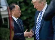  ?? THE ASSOCIATED PRESS ?? President Donald Trump shakes hands with Kim Yong Chol, former North Korean military intelligen­ce chief and one of leader Kim Jong Un’s closest aides, as after their meeting Friday in the Oval Office of the White House in Washington.