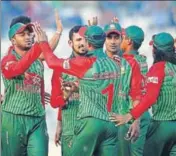  ?? AP ?? Bangladesh players celebrate the dismissal of Zimbabwe's Hamilton Masakadza in Dhaka on Tuesday.