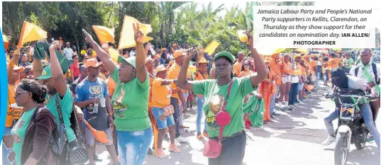  ?? IAN ALLEN/ PHOTOGRAPH­ER ?? Jamaica Labour Party and People’s National Party supporters in Kellits, Clarendon, on Thursday as they show support for their candidates on nomination day.