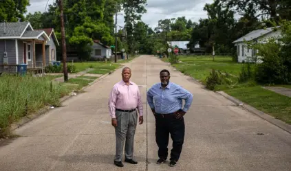  ?? Tamir Kalifa, The New York Times ?? Gerald Boudreaux, left, a state senator who represents the area, and brother Kenneth Boudreaux, a former Lafayette City- Parish councilman, grew up in Lafayette, La. Residents of the struggling Mccomb neighborho­od remain wary of a decades- long project to replace the Evangeline Thruway with an elevated highway.