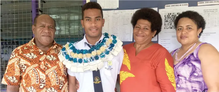  ??  ?? From left: Father Iowane Bulivou, William Cross College headboy Alifereti Ledua, mother Siteri Bulivou, and Seini Vatale at the school yesterday.