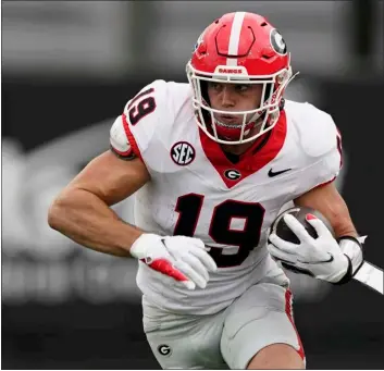  ?? GEORGE WALKER IV — THE ASSOCIATED PRESS ?? Georgia tight end Brock Bowers runs with the ball after a catch against Vanderbilt in the first half of an NCAA football game on Saturday, Oct. 14, 2023in Nashville, Tenn.