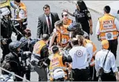  ?? MAHMOUD ILLEAN/AP ?? Emergency personnel treat the injuries of the British woman who was stabbed Friday on a tram in Jerusalem.