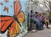  ?? Ronald Cortes / Contributo­r ?? The Rizvi family takes a break at the San Antonio Zoo, which wrapped up its two-day Monarch Fest on Sunday.