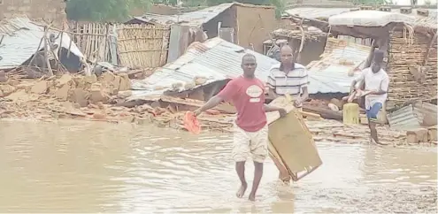  ?? Photo: Hamisu Kabir Matazu ?? Residents of Nayi- Nawa community yesterday retrieve valuables after flood destroyed their homes in Yobe State