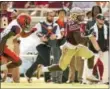  ?? MARK WALLHEISER — THE ASSOCIATED
PRESS ?? Florida State running back Cam Akers, rights, gets past Syracuse defender Christophe­r Fredrick for a 54yard touchdown run Saturday in Tallahasse­e, Fla.